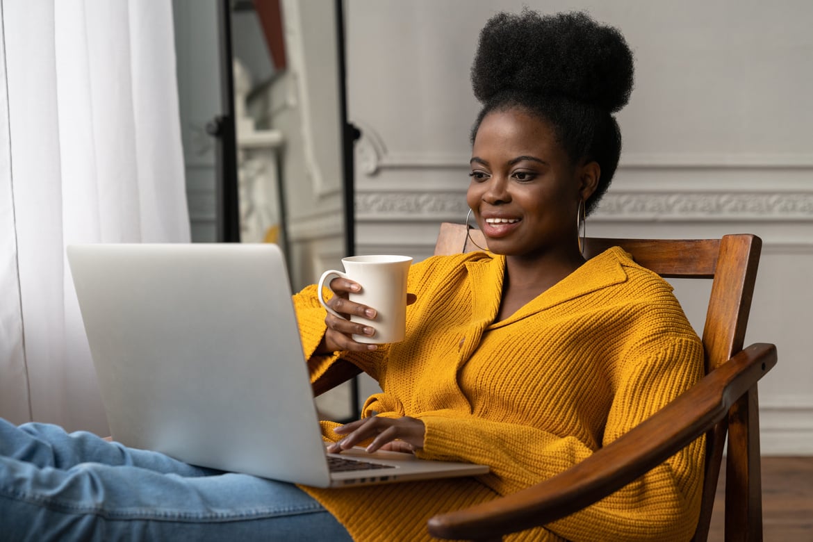 Happy Millennial Woman Working at Home